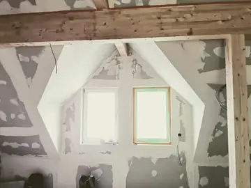 Dachgeschossausbau zwischen altem Fachwerk
